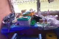 A baby sleeping dangerously on a table