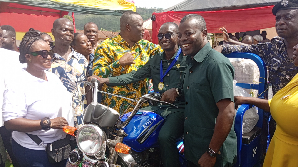 The best farmer, Jonas Nomo flanked by the MP, Albert Nyakotey and MCE, Francis Addo Akumatey