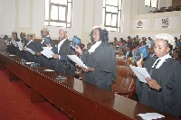Ms Justice Sophia A.B Akuffo (left), the Chief Justice, swearing the new circuit court judges into o
