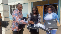 Professor Kingsley Nyarko (left) inspecting the tablets