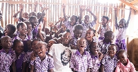 late Christian Atsu with some kids during his charity works.