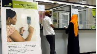 Customers making electricity payments at the Kampala Umeme branch in Uganda