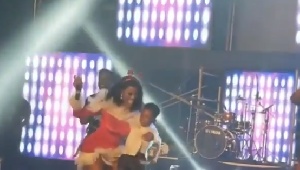 Wendy Shay carries actor Don Little in her hands like a 'baby' at 2018 Rapperholic