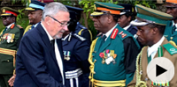 Vice President Guy Scott greets defense and security chiefs shortly after taking over position