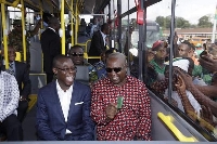 Mahama (in black shades) holding an Aayalolo card during its launch in 2016