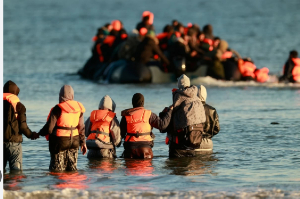 Migrants board a small boat in an attempt to reach Britain, April 8, 2026 in Malo-les-Bains