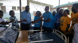 Members of the Ajumako Teachers Credit Union making the donation