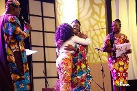 Naa hugs Ohema, as hosts Johnnie and Ama look on