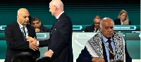 Gianni Infantino shakes hands with Moshe Zuares as Jibril Rajoub exits stage
