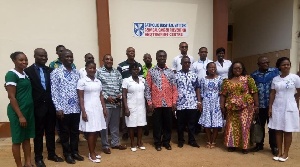 Minister for Science,Technology and Innovation, Dr. Kwabena Frimpong-Boateng with the hospital staff