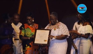 Mrs. Gifty Afenyi-Dadzie receiving her citation at the Harvest Praise 2018 event