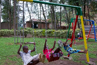 Children play on playground equipment at the Mutobo Demobilisation and Reintegration Centre