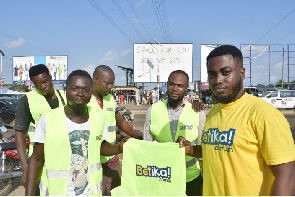 Some of the motor riders receiving their reflector jackets