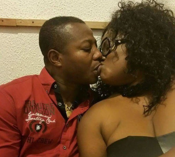 Mercy Asiedu and husband in a passionate kiss