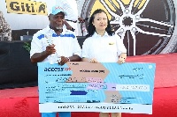 Chinese ambassador to Ghana, Sun Baohong presents a cheque to Amos Koblah