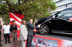 MD of Total Ghana, Olivier Van Parys cutting the tape to launch the promo