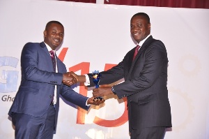 Mr. Solomon Lartey (right) presenting one of the awards to SMEs at the ceremony