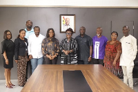 Abla Dzifa Gomashie (M) with some attendees in a group photgraphy