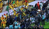Senegal supporters clash with security services after a controversial penalty during ACN final match