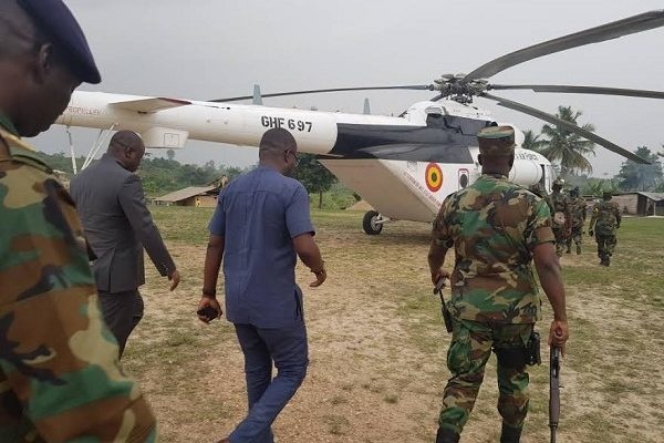 Defence Minister, Dominic Nitiwul and John Peter Amewu being accompanied by the military