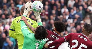 Players holding on to a goalkeeper's arm as they try to play the ball will be considered foul Players holding on to a goalkeeper's arm as they try to play the ball will be considered foul