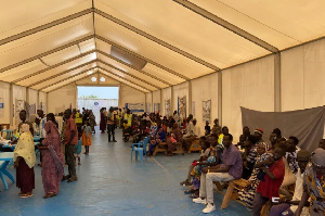 Families gather at a WFP centre in Renk, South Sudan, after fleeing Sudan