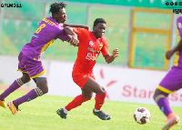 Former Kotoko player Eric Zeze (middle) in action against Medeama