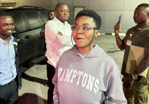 Suzzy Pinamang wearing her eye glasses upon arrival in Ghana