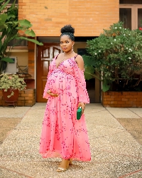 MzBel shared pictures of herself with a full baby bump