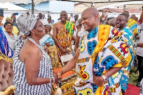 two traditional leaders exchange greetings