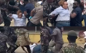 Former Minister of Fisheries, Mavis Hawa Koomson being rescued from the thugs by police officers