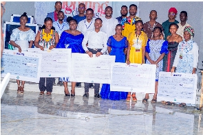 Young entrepreneurs receiving cash prizes during the 2023 Igniting Dreams program