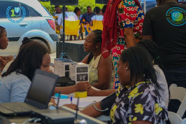 Some staff of the clinic attending to people at the outdoor event