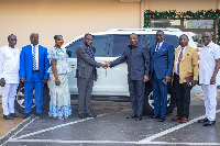 Rew Wengam presenting the vehicle to Rev. Moses Nasimong