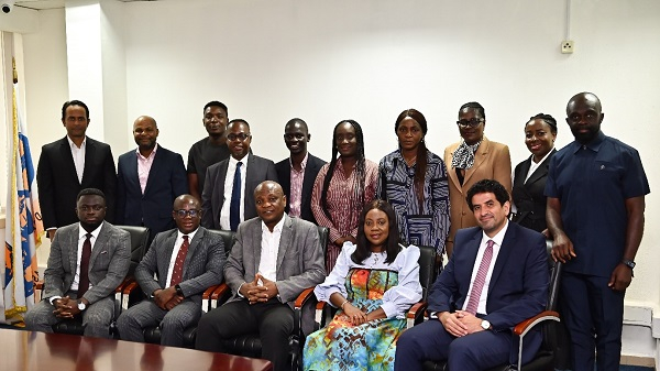 Togbe Afede XIV with some of his official staff and members of the Telecel Ghana team