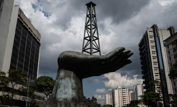 A sculpture of a hand holding an oil well outside Petroleos de Venezuela headquarters in Caracas