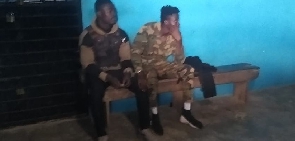 Two of the suspected soldiers at the police station before their bail