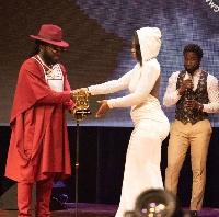 Sexy Juicee (R) receiving her trophy