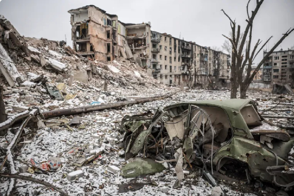 Destroyed residential buildings and a burned-out car in the Donetsk region front-line town
