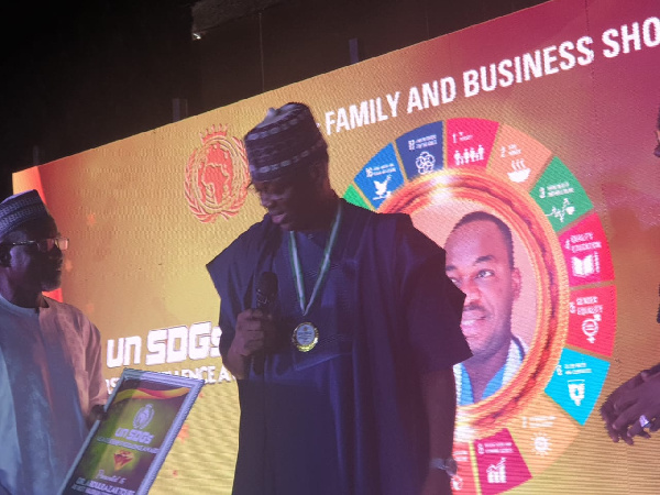 Dr. Abdul Razak Toure being presented with his award in Nigeria