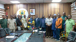 Minister of Lands and Natural Resources in a group picture with Committee members