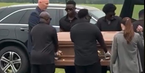 A Picture of George Blays body being carried in a casket