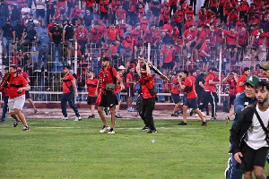 Fans invaded the pitch before the game