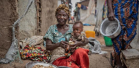 A woman and a child are pictured at a displaced persons camp near Bunia, Ituri Province, DRC