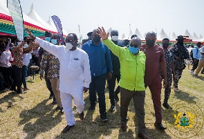 Nana Akufo-Addo (green shirt) with Owusu Afriyie Akoto (all-white outfit)