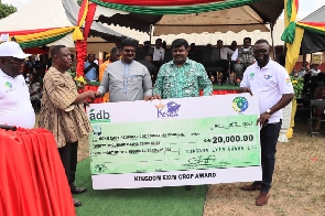 Dr. James Rajamani and Dr Emmanuel Rajamani presenting a dummy cheque to the Bono East minister