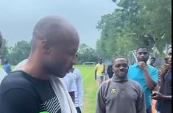 Dede Ayew (with towel around his neck) engaged some players after a training session
