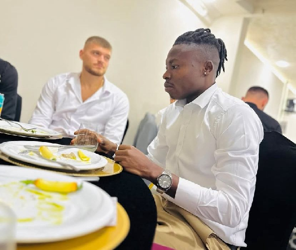 Salifu Ibrahim at a restaurant in Kosovo