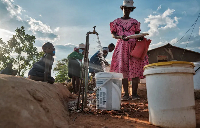 Residents queue to collect water as temperatures soar during an El Nino-related heatwave