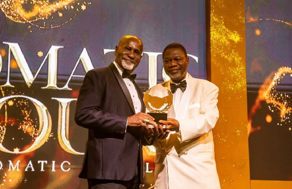 Dr. Andrew Kwabena Asamoah [L] receiving his award